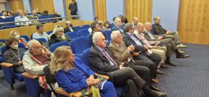 Φωτογραφία από την ημερίδα με ομιλητές και ακροατήριο